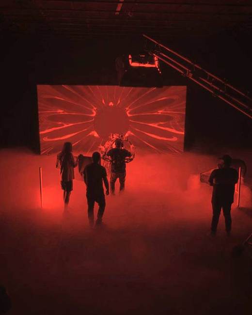 Music video set with red lighting and haze at Cascabel Studios